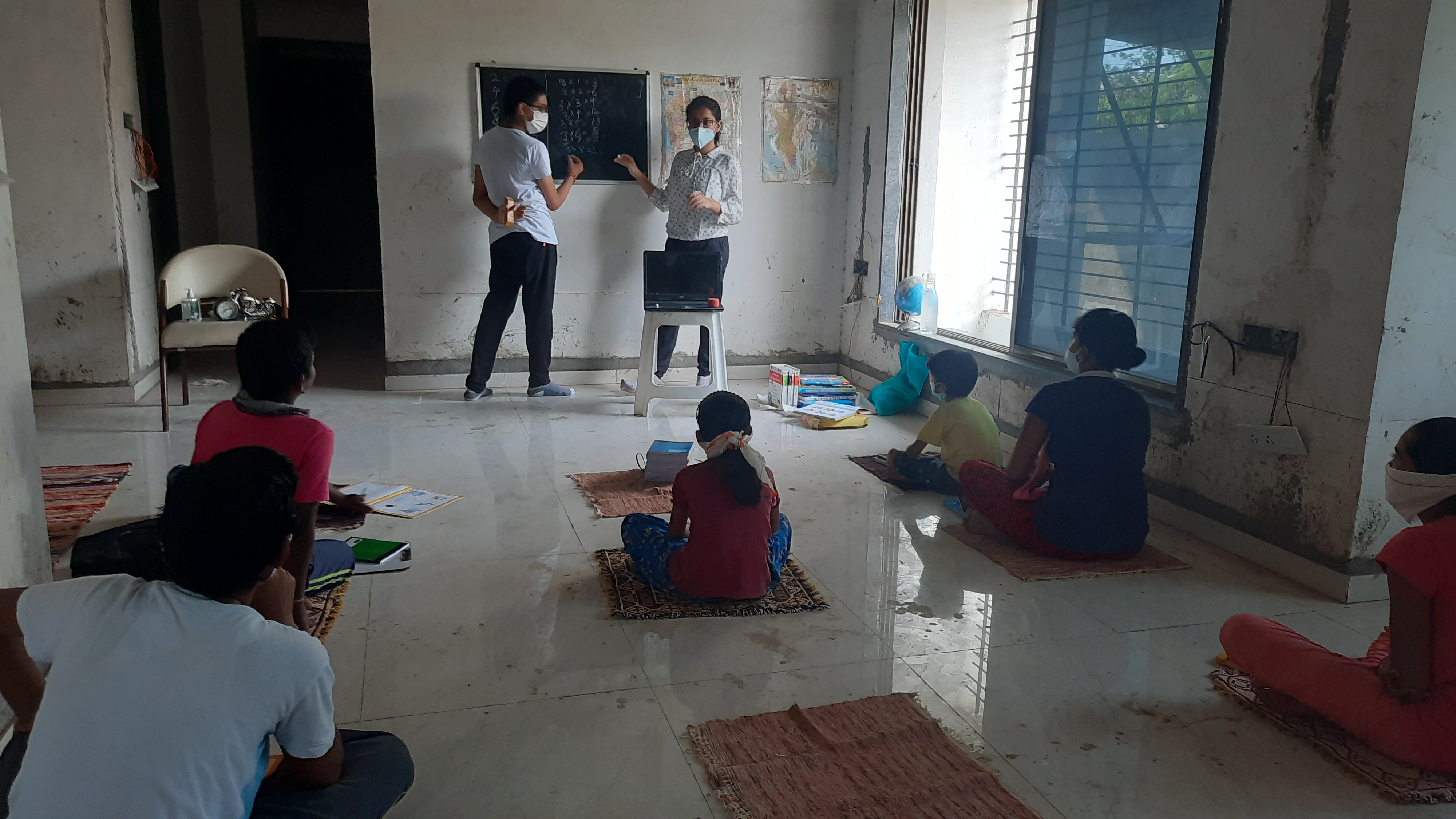 Cofounders in their first classroom